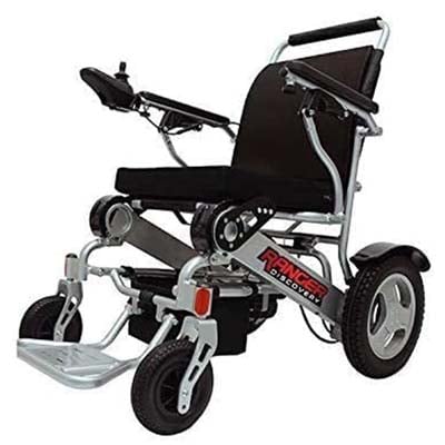 The Porto Mobility Ranger Electric Wheelchair with a joystick controller attached to its right armrest