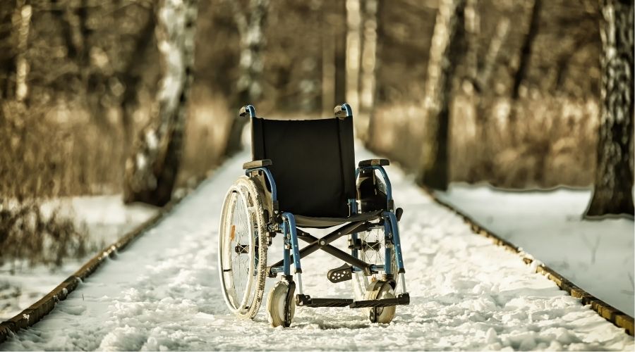 Wheelchair in a snowy path