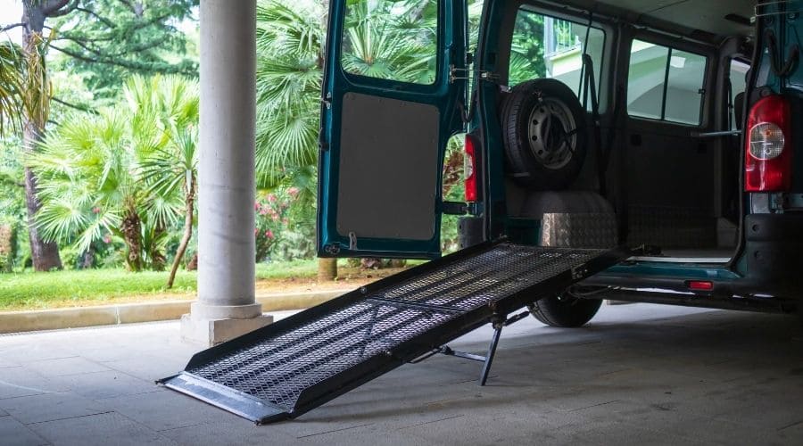 A wheelchair ramp attached to the rear of a van