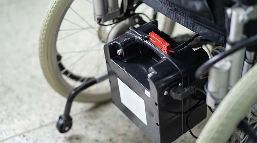 Lithium battery attached to the middle rear of a wheelchair