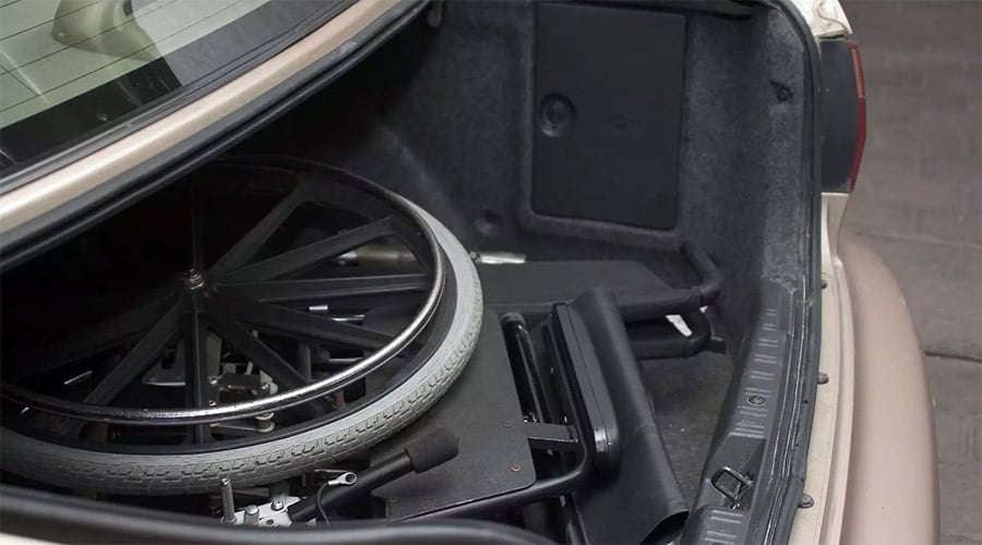 Folded wheelchair in a car's trunk