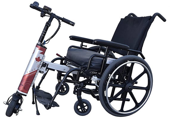 A power assist system connected to a folding manual wheelchair