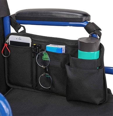 An organizer with contents attached to the side of a wheelchair 