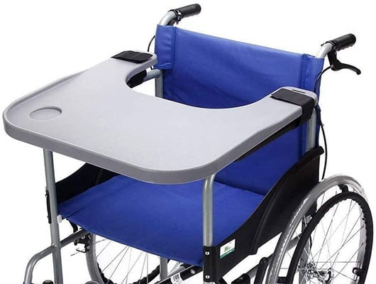 A wheelchair with Blue upholstery and work tray