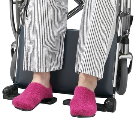 Leg huggers attached to the leg bars of a wheelchair