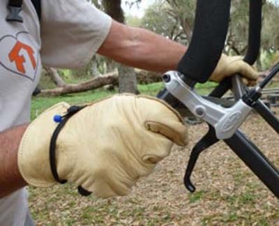 A person holding the hand grips of Black Diamond Trail Rider 