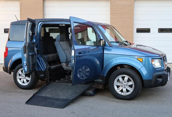 Blue Honda Element XWAV with open side doors and ramp