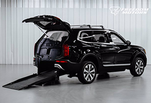 Kia Telluride S FWD Sport Utility with open rear door and ramp