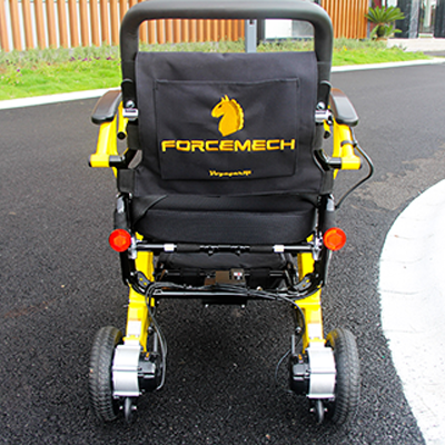 Forcemech Voyager R2 Wheelchair on a concrete road with fence in the background