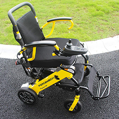Voyager power wheelchair on a concrete road outdoor 