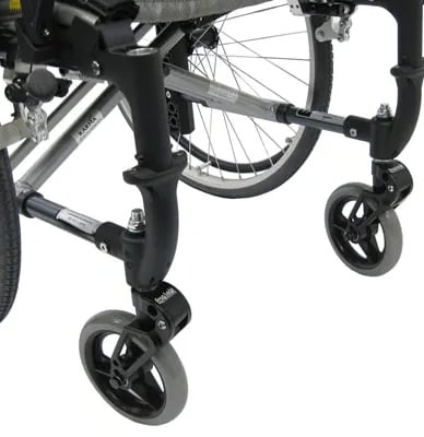 Frog Legs casters attached to a wheelchair