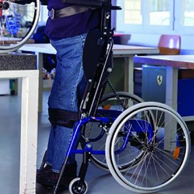 A person strapped to the LCEV by Levo Wheelchair in a standing position
