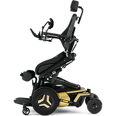 Permobil F5 Corpus VS with gold base frame and in a standing position