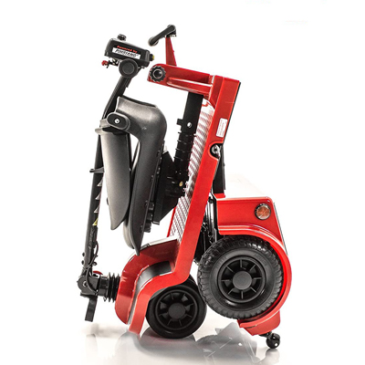 Folded red Shoprider Echo scooter in a standing position