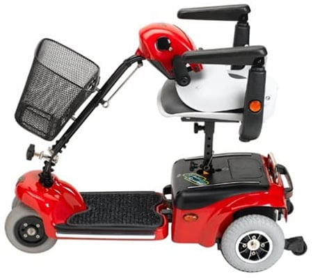 Red Shoprider Scootie Mobility Scooter with its tiller bent touching its chair